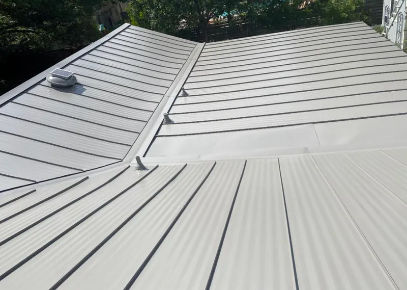 Solar attic fan installed on a metal roof for Roof Ventilation in Sapulpa
